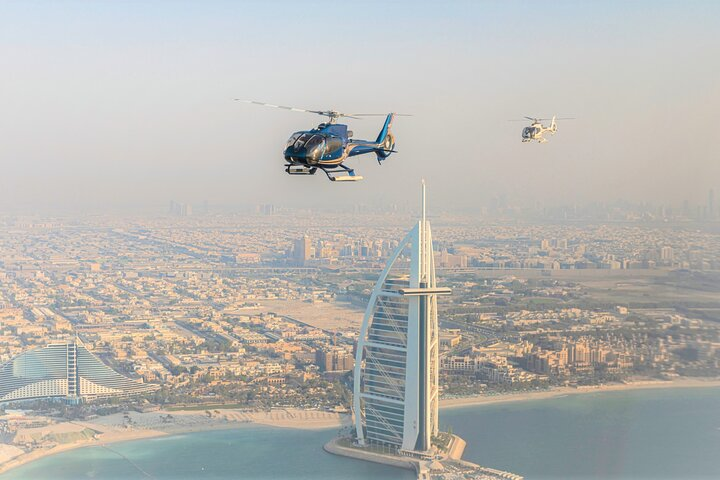 Soar above Dubai’s stunning skyline capturing breathtaking views of iconic landmarks and pristine coastlines. Experience the magic of Palm Jumeirah and the Burj Khalifa like never before.